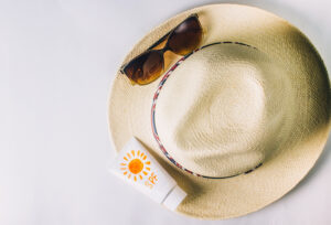 sun hat, sunglass and sunscreen