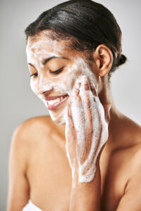 woman washing her face