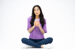 woman sitting and drinking juice